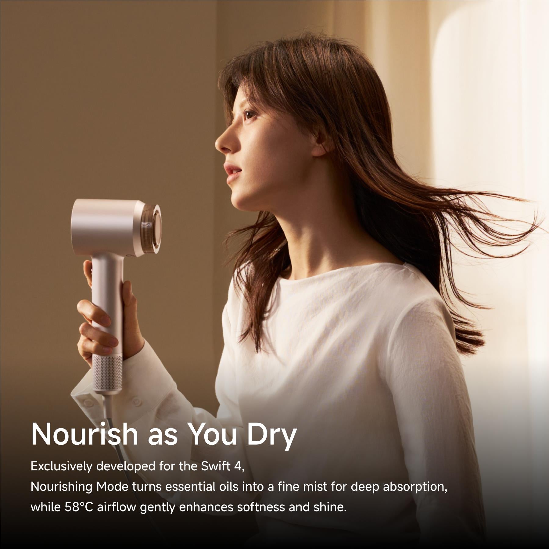 Platinum hair dryer in nourishment mode while drying hair