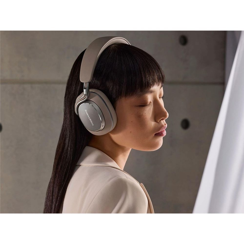 Warm Stone over-ear headphones worn by a woman, profile side view