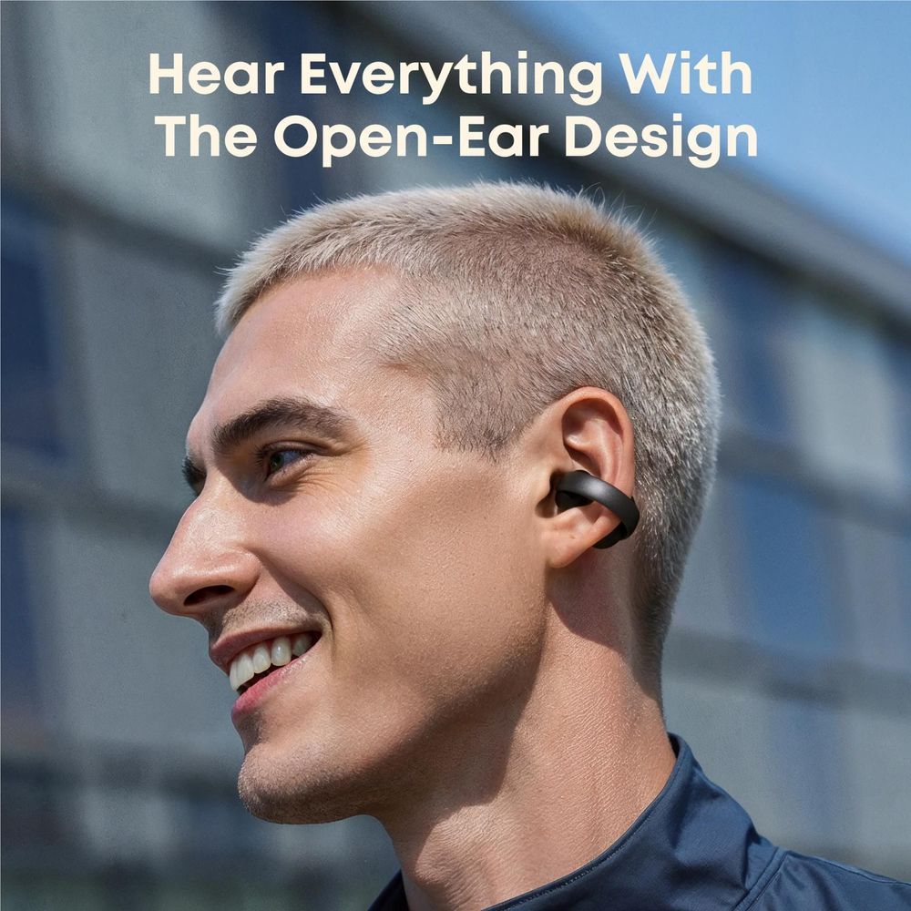 Black open-ear clip-on earbuds worn on a man’s ear, compact earhook design.