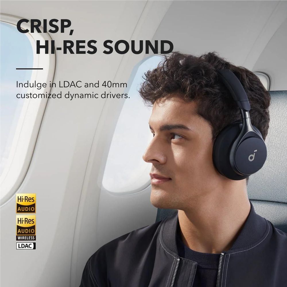 Black over-ear headphones worn by a person, side profile showing padded earcups.