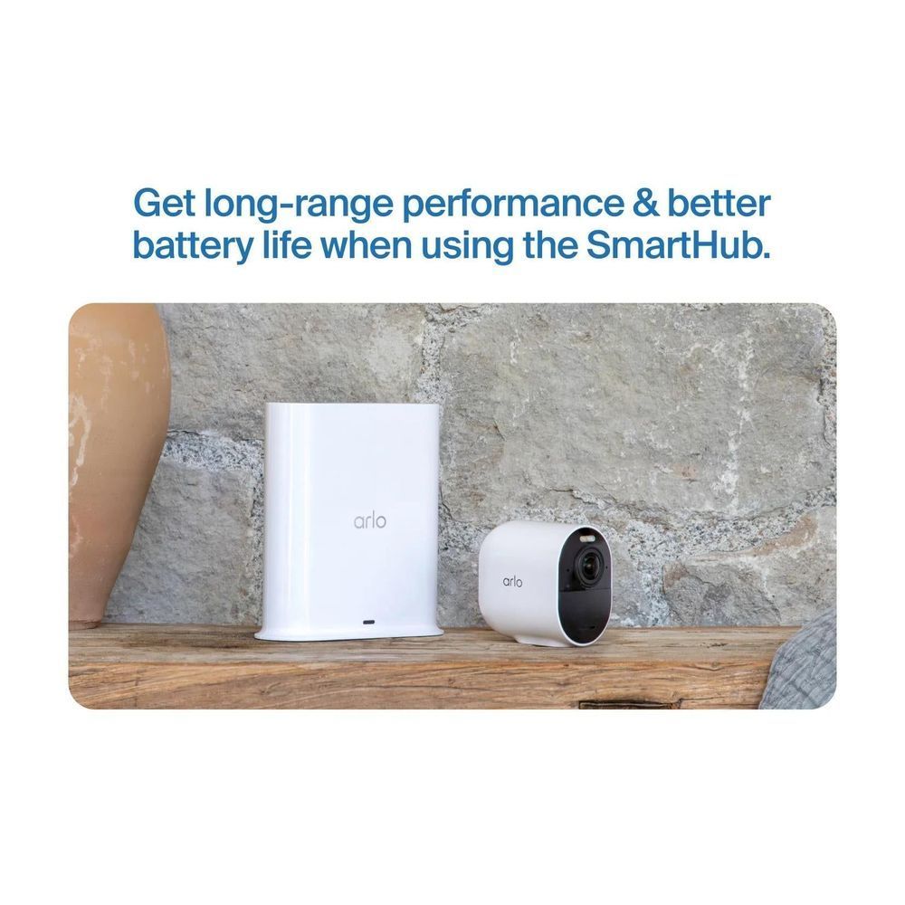 SmartHub and outdoor security camera, white devices with compact cylindrical camera body