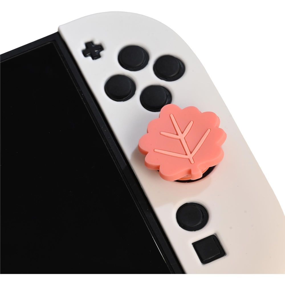 White controller right side with coral leaf button and black action buttons