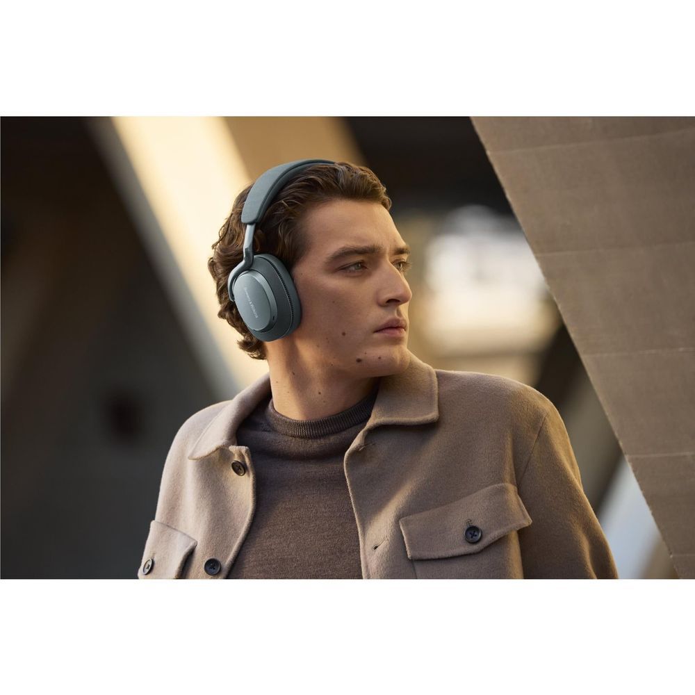 Frost blue over-ear headphones worn by person, adjustable headband and ear pads