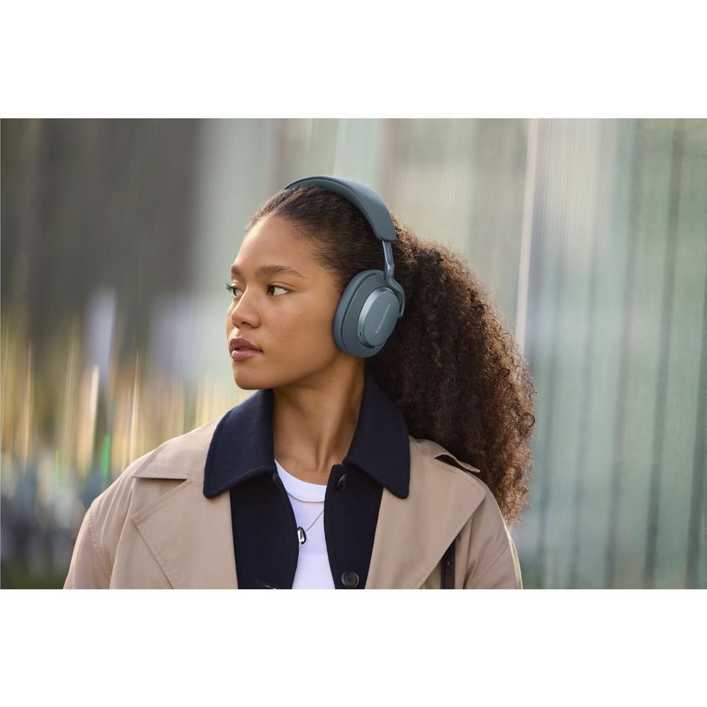 Frost blue over-ear headphones worn by person, side view with padded ear cup