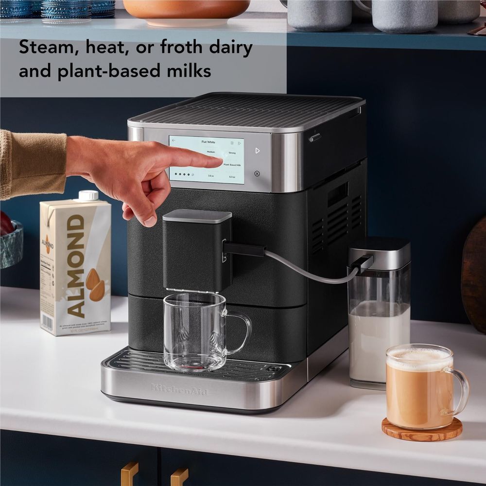 KitchenAid fully automatic espresso machine with milk container, glass cup area and spouts