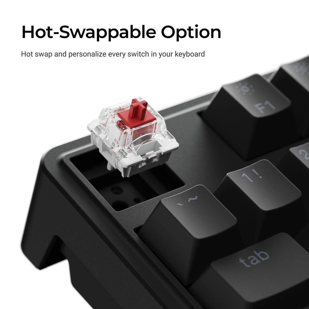 Hot-swappable mechanical key switch with clear housing and red stem on black keycap
