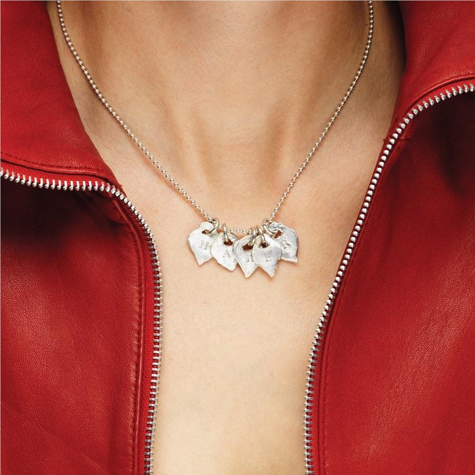 Silver charm necklace with small animal pendant cluster and thin chain