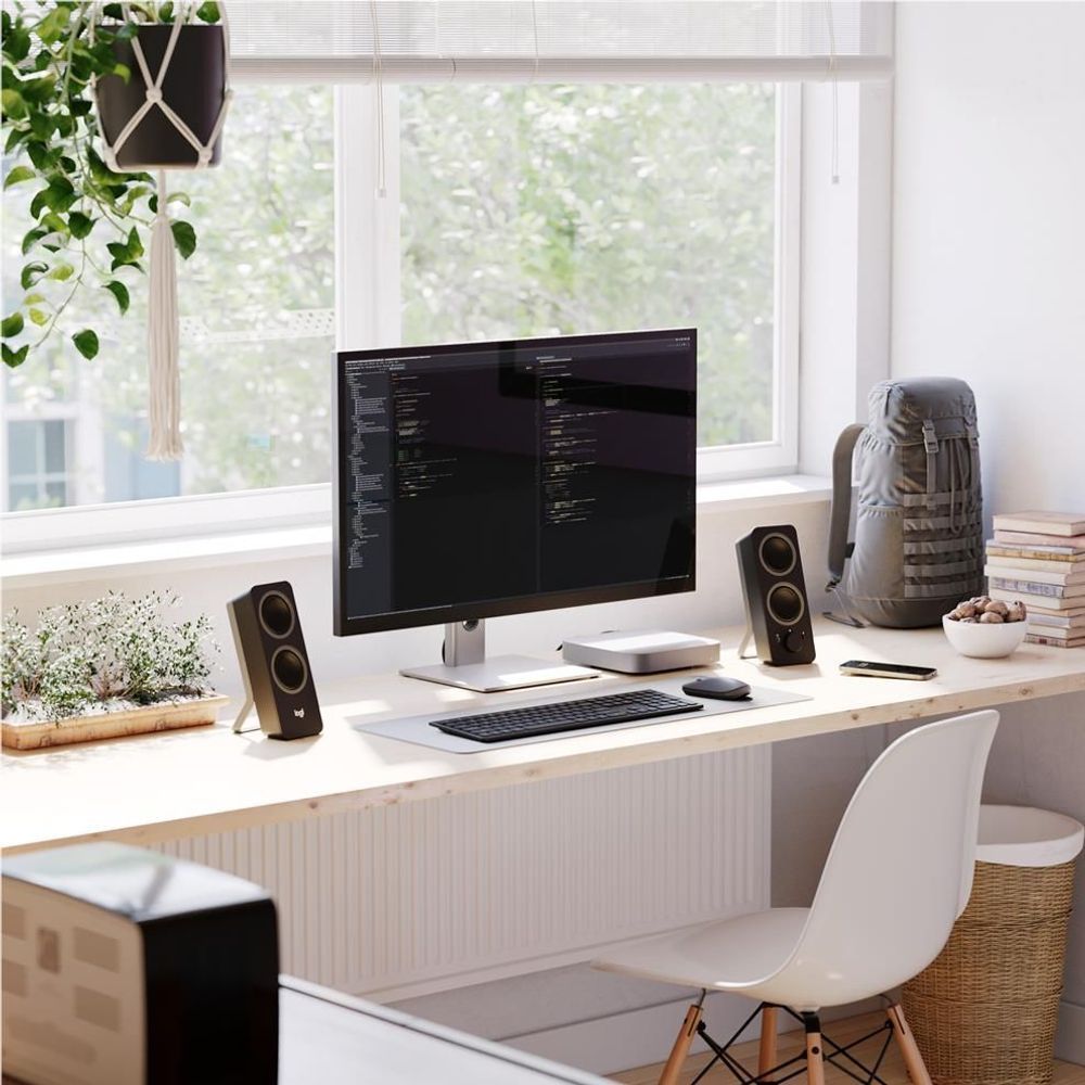 27-inch UHD monitor with silver base, showing dark code editor on the display.