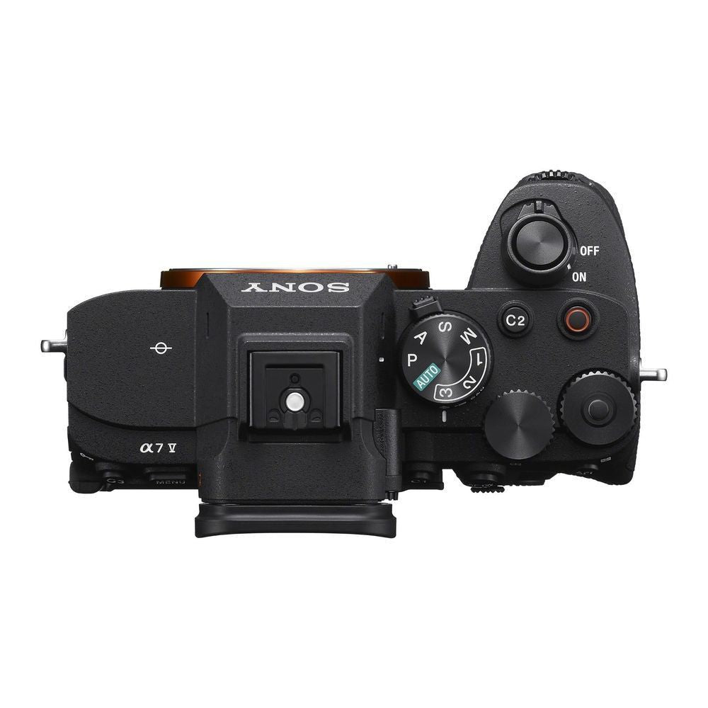 Black mirrorless camera body top view with dials, hot-shoe, and shutter controls