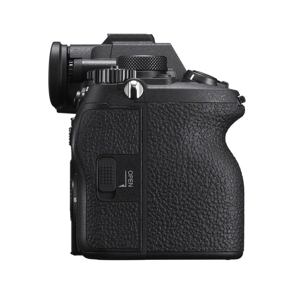 Black mirrorless camera body with textured grip and control cover panel