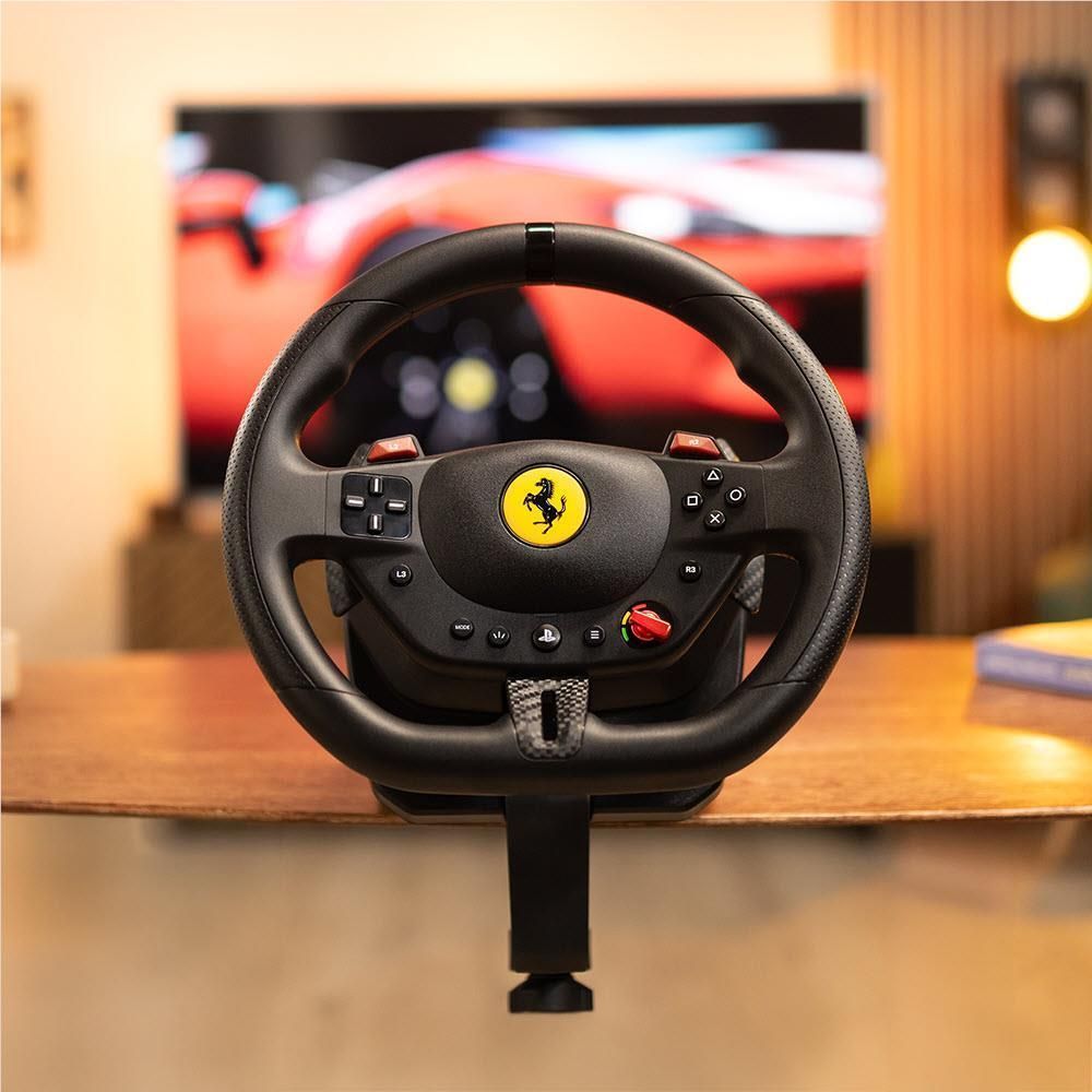 Thrustmaster racing wheel controller with Ferrari crest, black rim, and button panel
