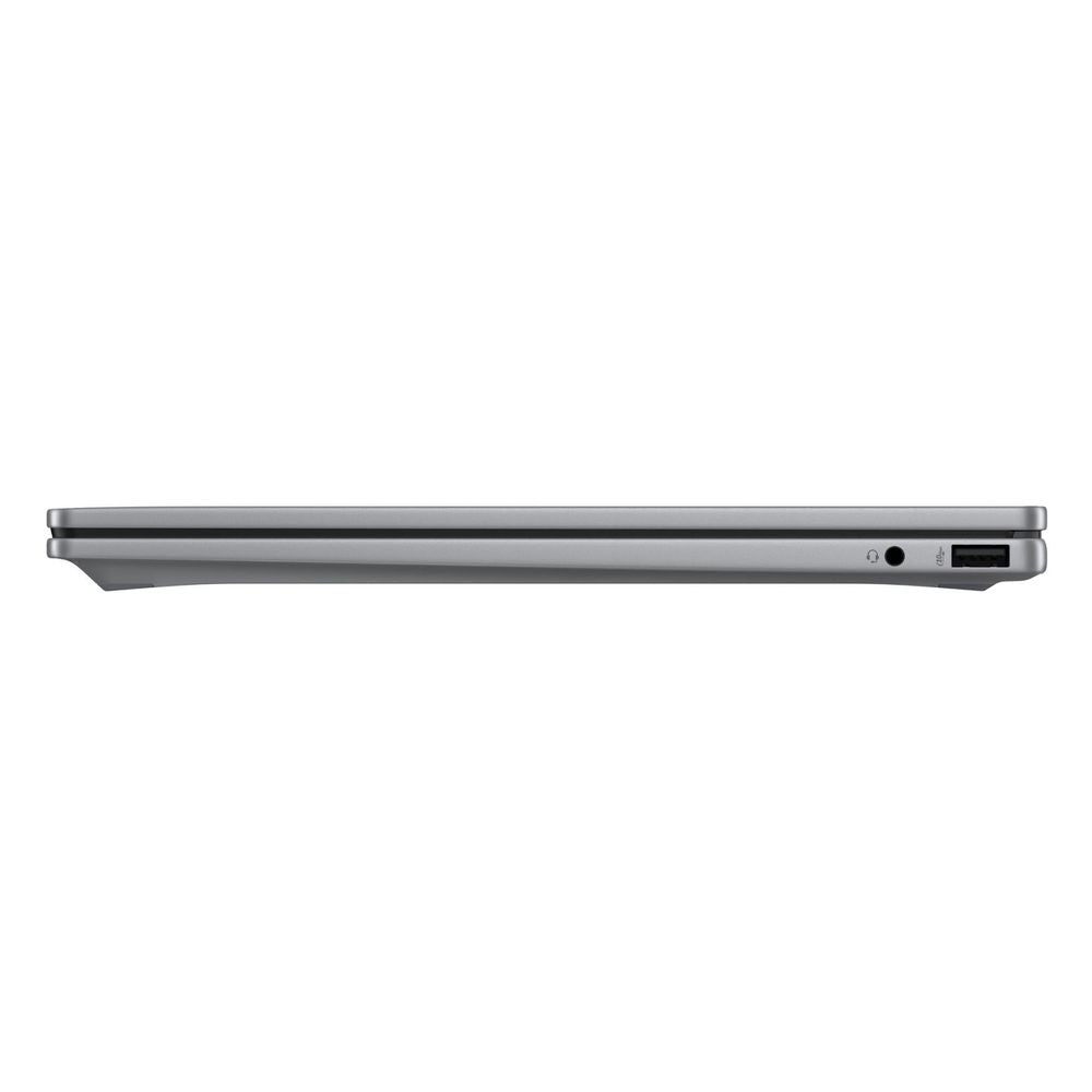 Silver laptop side view with slim profile and power port opening