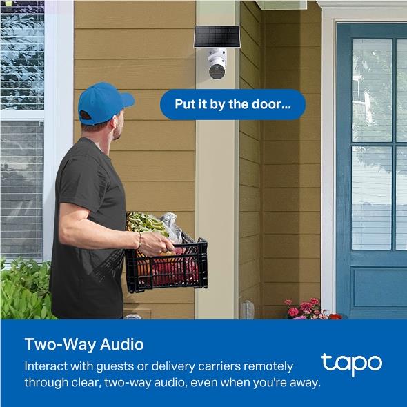 Wall-mounted solar security camera kit beside a front door and delivery basket