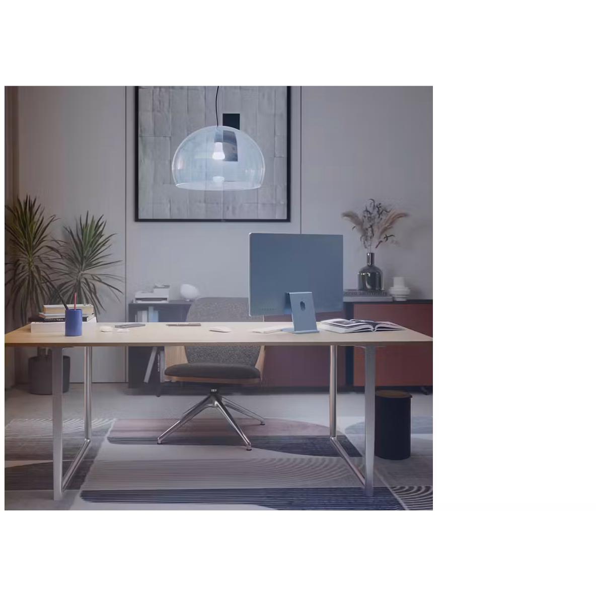 Smart bulb emitting bright light in a modern office room.
