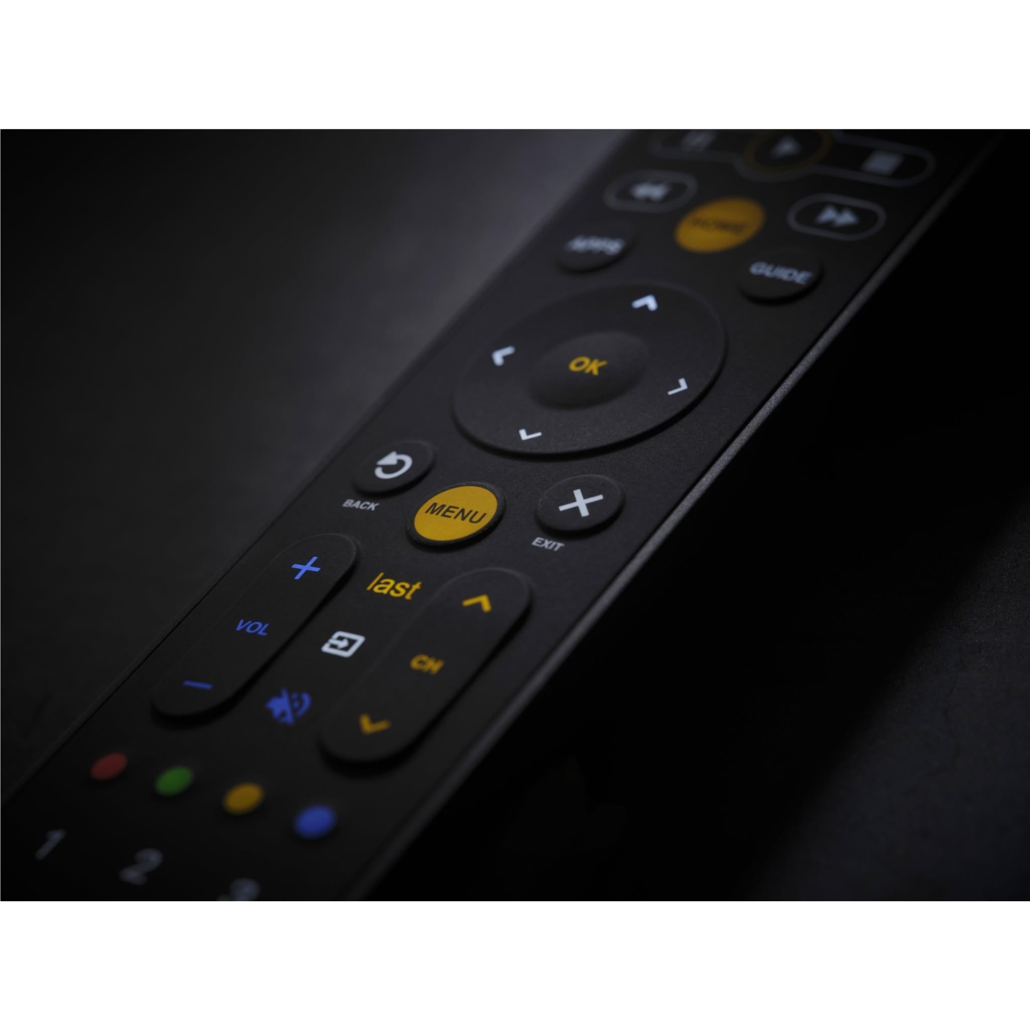 Close-up of universal TV remote buttons, navigation pad, and plus/minus volume keys.
