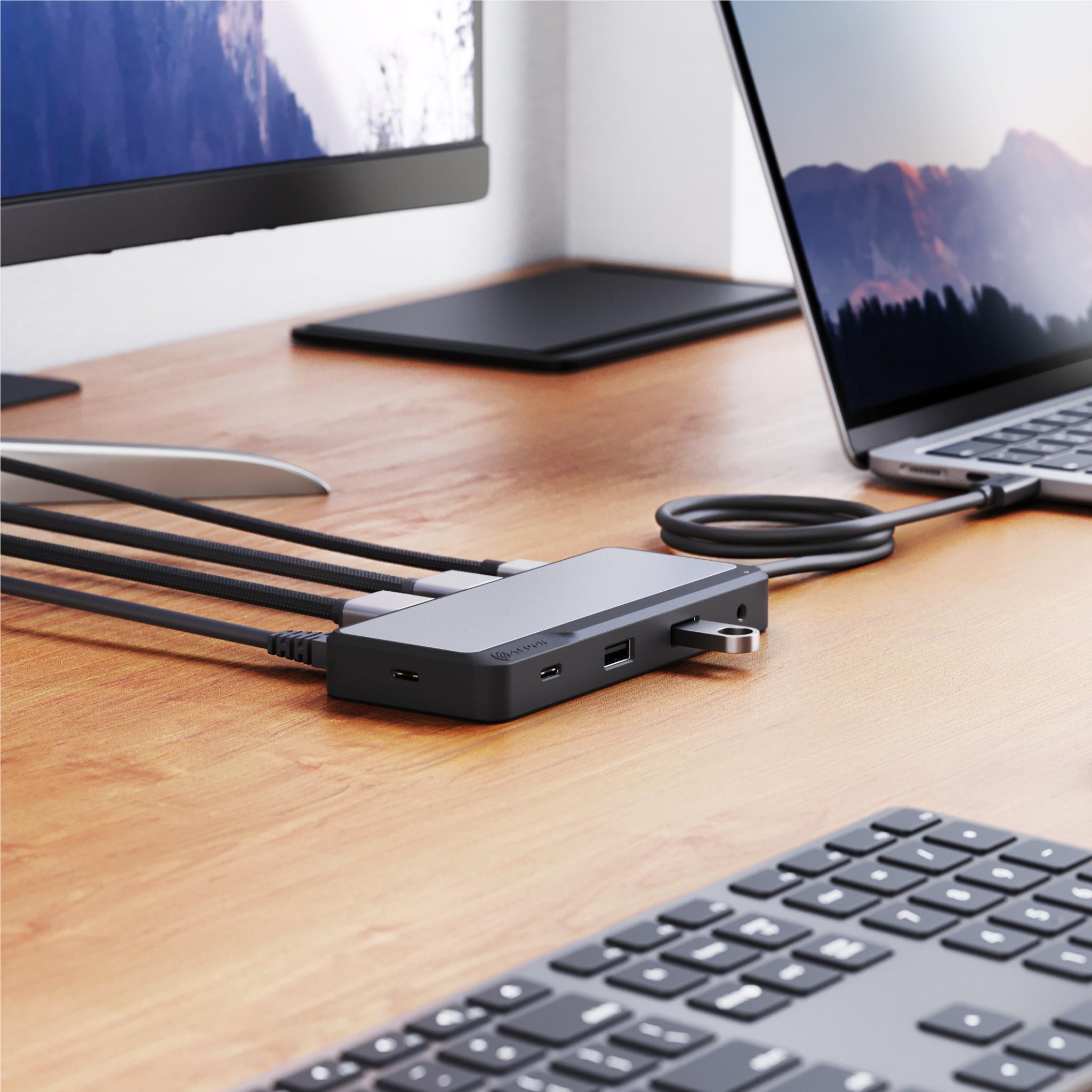 USB-C dual HDMI docking station connected to a laptop, with ports facing toward the viewer