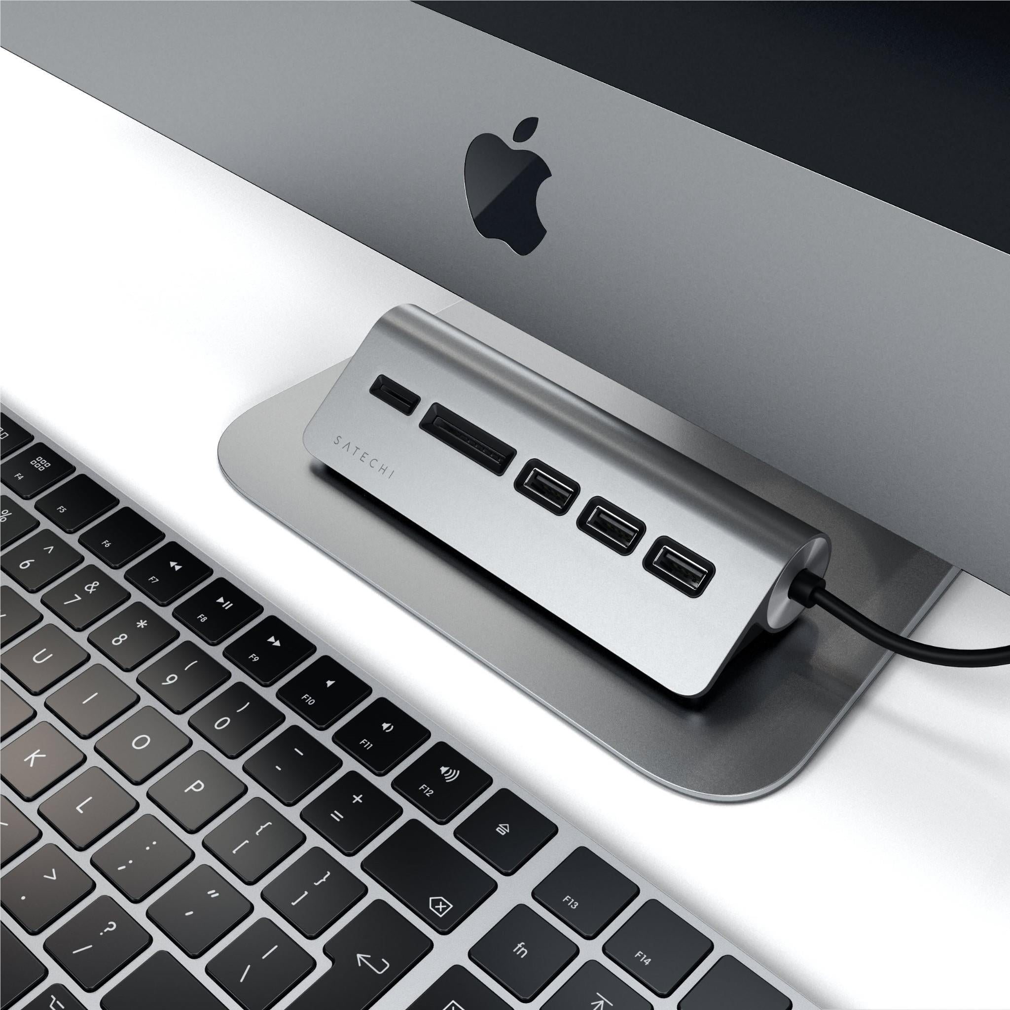 Space gray USB-C combo hub connected to a laptop with USB-C cable