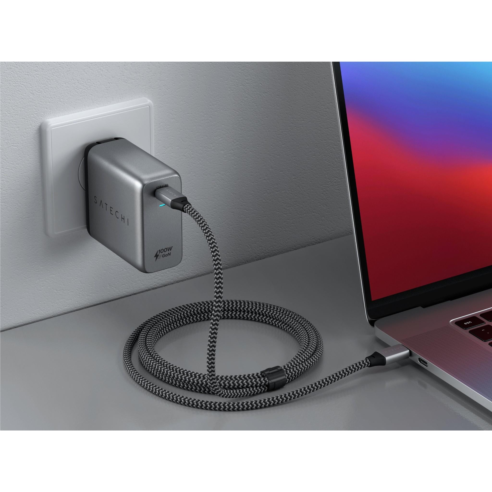 Grey Satechi 100W GaN USB-C wall charger plugged into outlet with cable