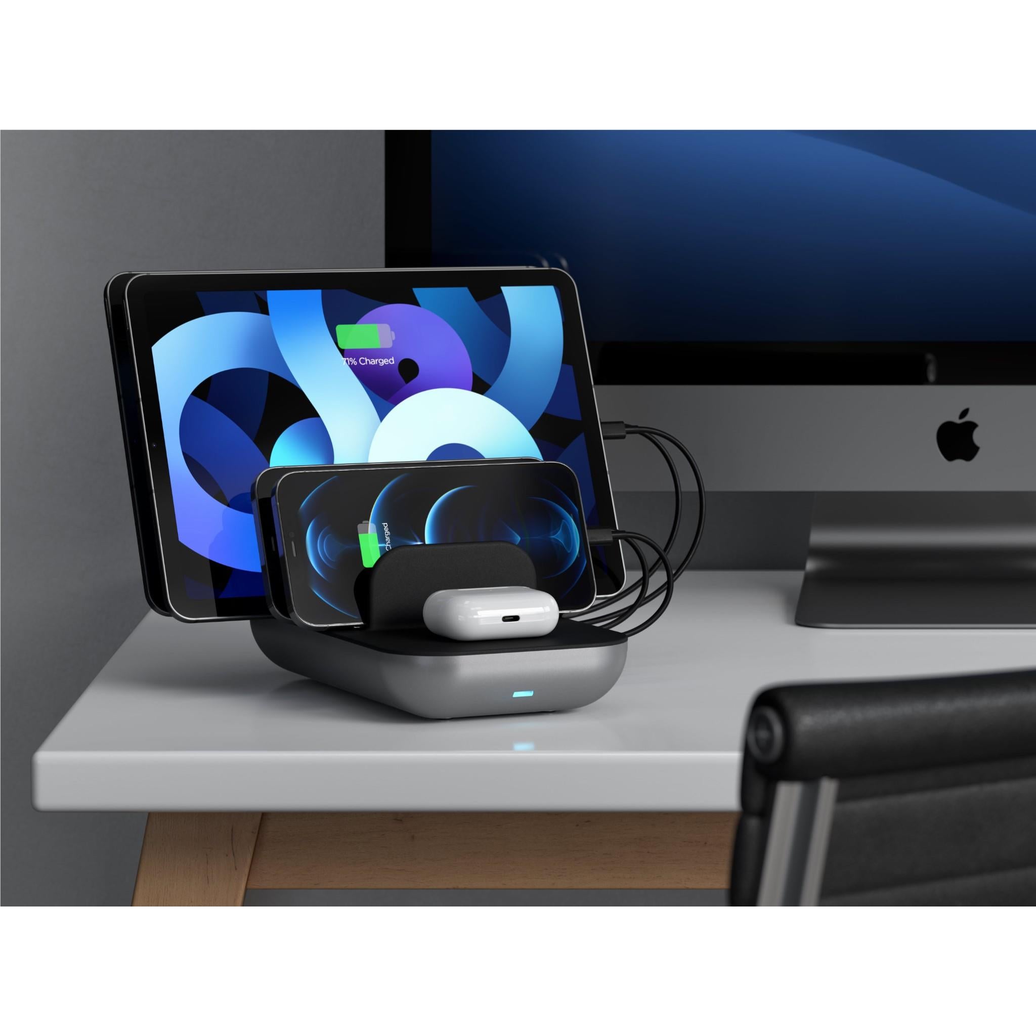 Black charging station with Qi pad and dock arms in use with tablet