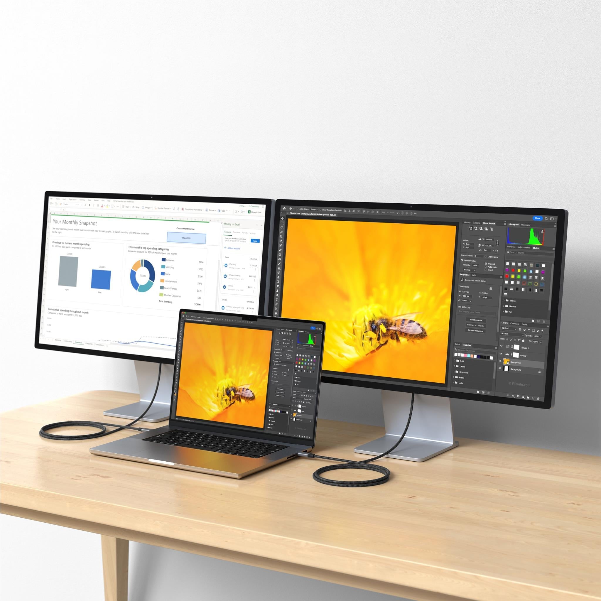 USB-C to USB-C cable on desk connecting devices with black braided housing