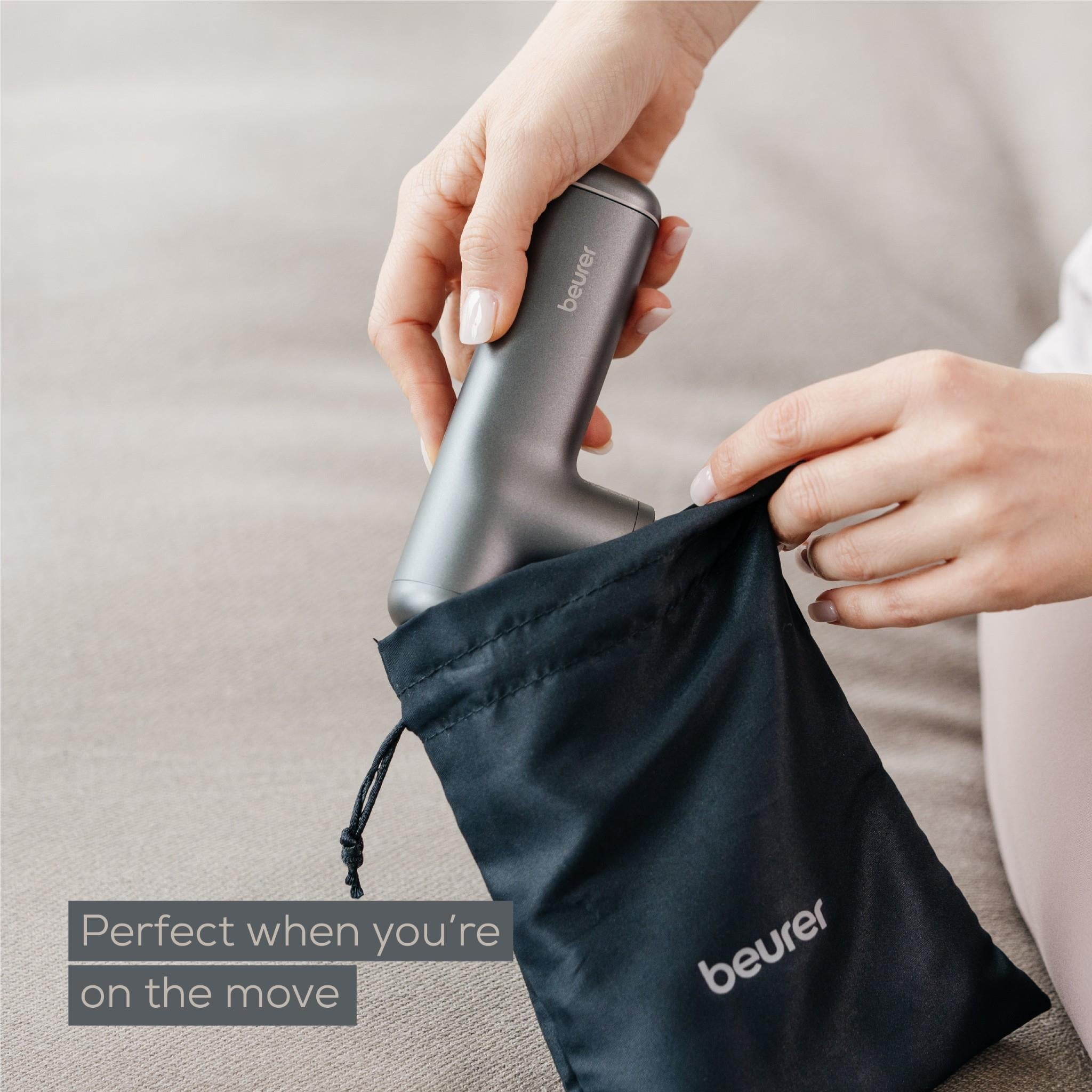 Grey Beurer massage gun with storage pouch and handle close-up