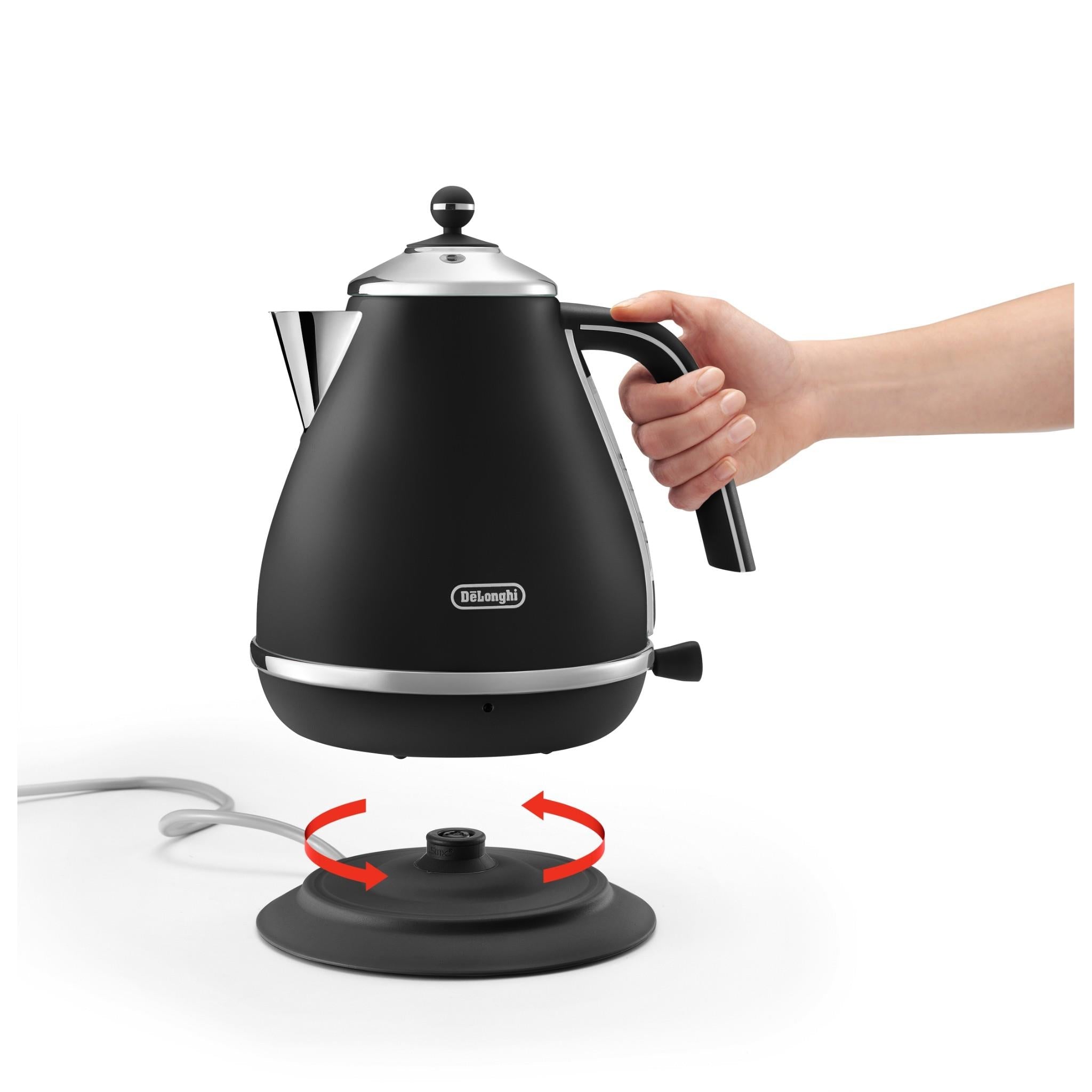 De'Longhi electric kettle on base, hand gripping handle with rotating bottom contact