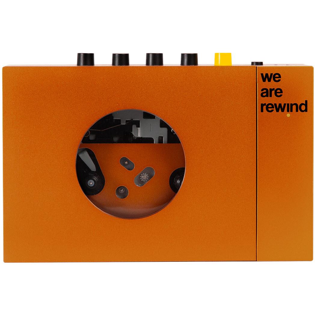 Orange cassette tape player with round window and "we are rewind" logo