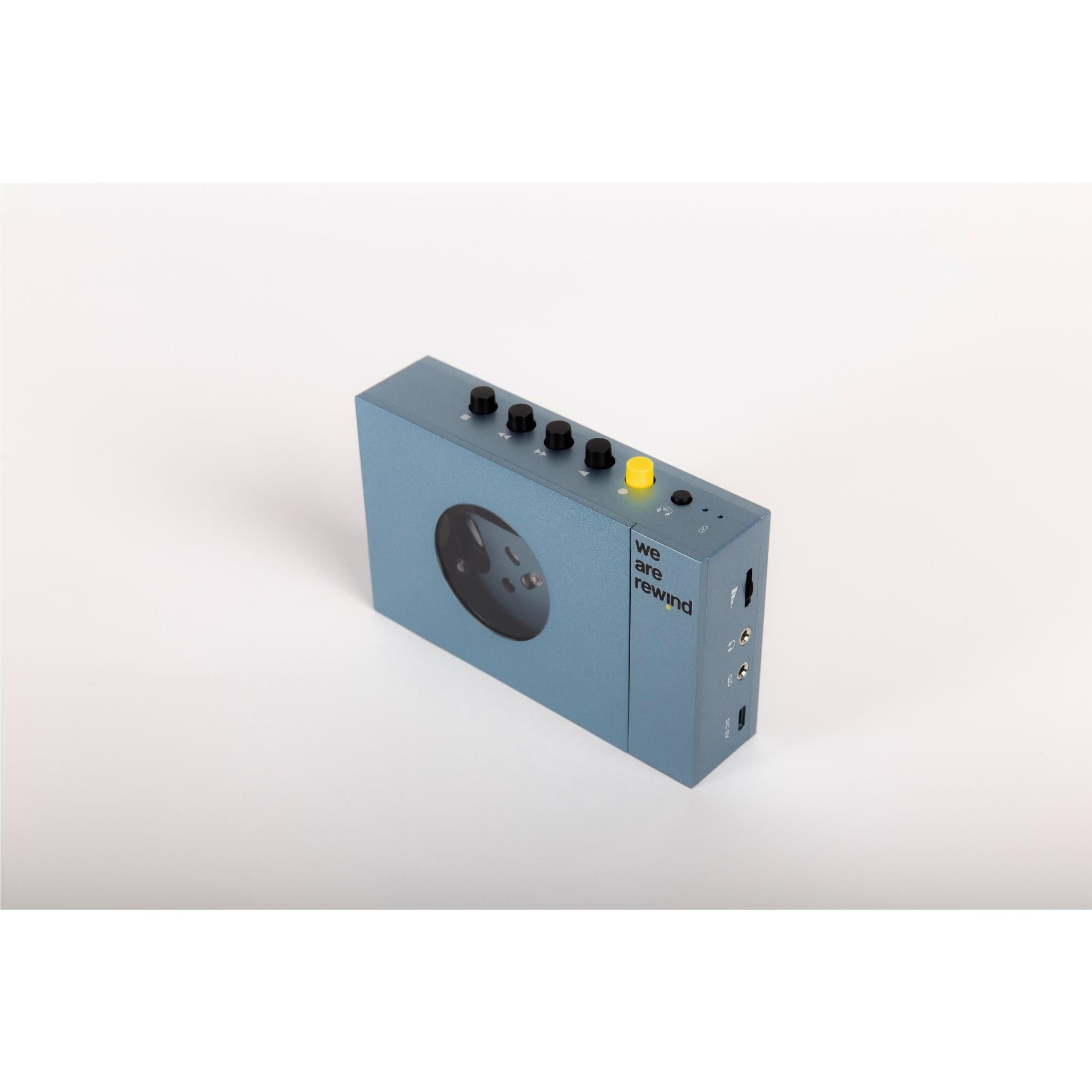 Blue rechargeable Bluetooth cassette player side view with control knobs and ports