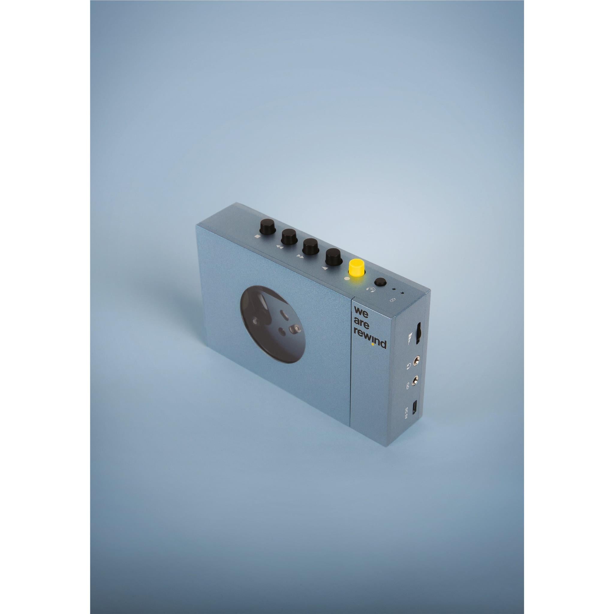 Blue rechargeable Bluetooth cassette player angled view showing top controls and ports