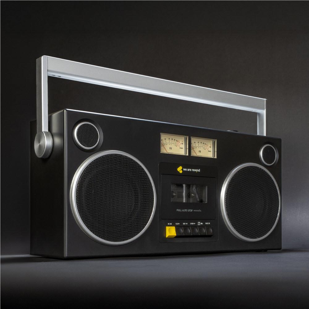 Black cassette boombox with raised handle frame and dual speaker grilles