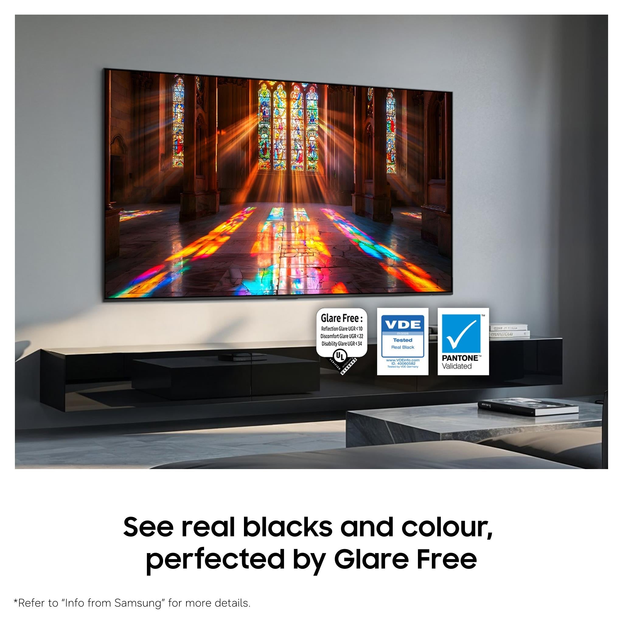 OLED smart TV showing stained-glass scene on a wall-mounted stand