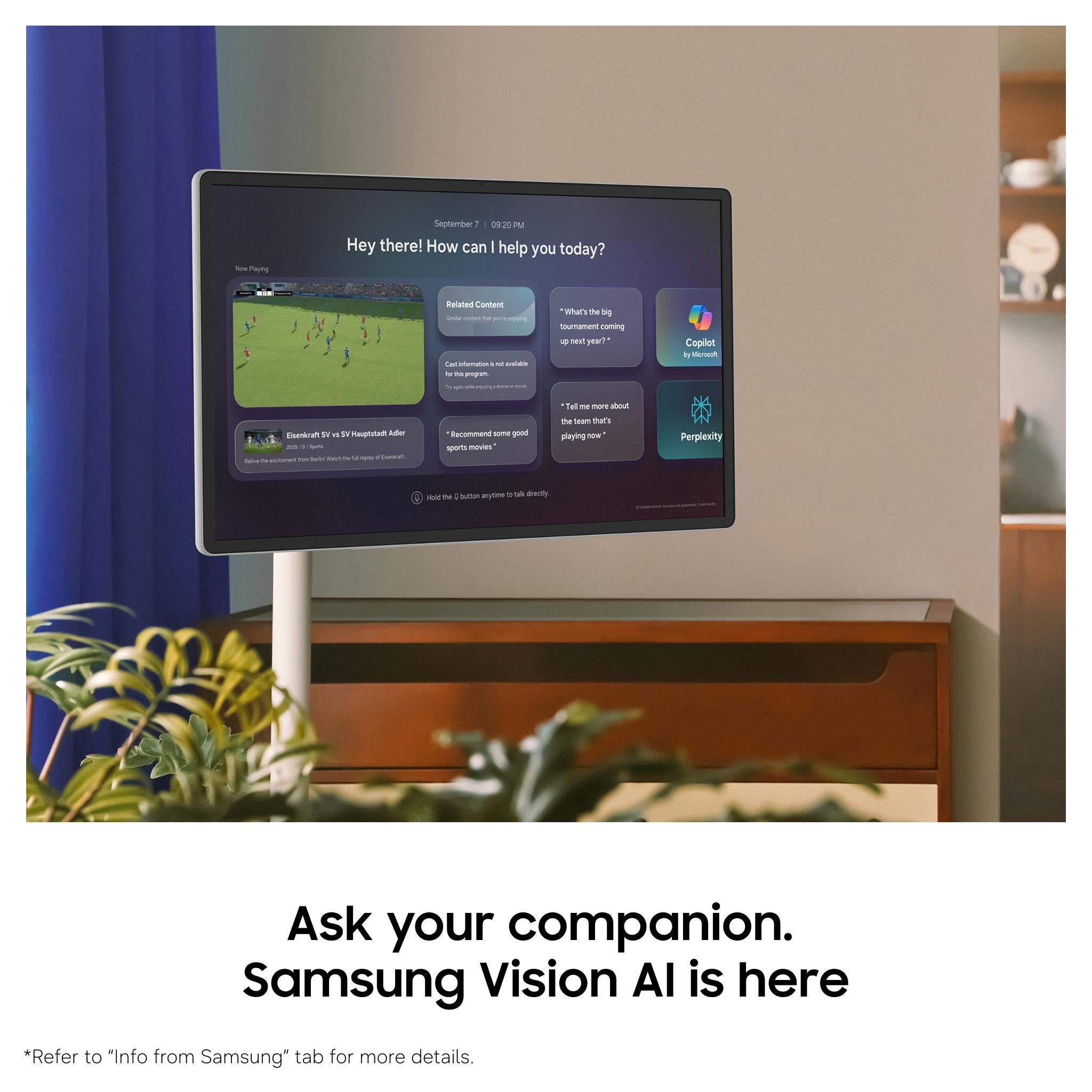 Smart TV on white stand showing chat interface on display