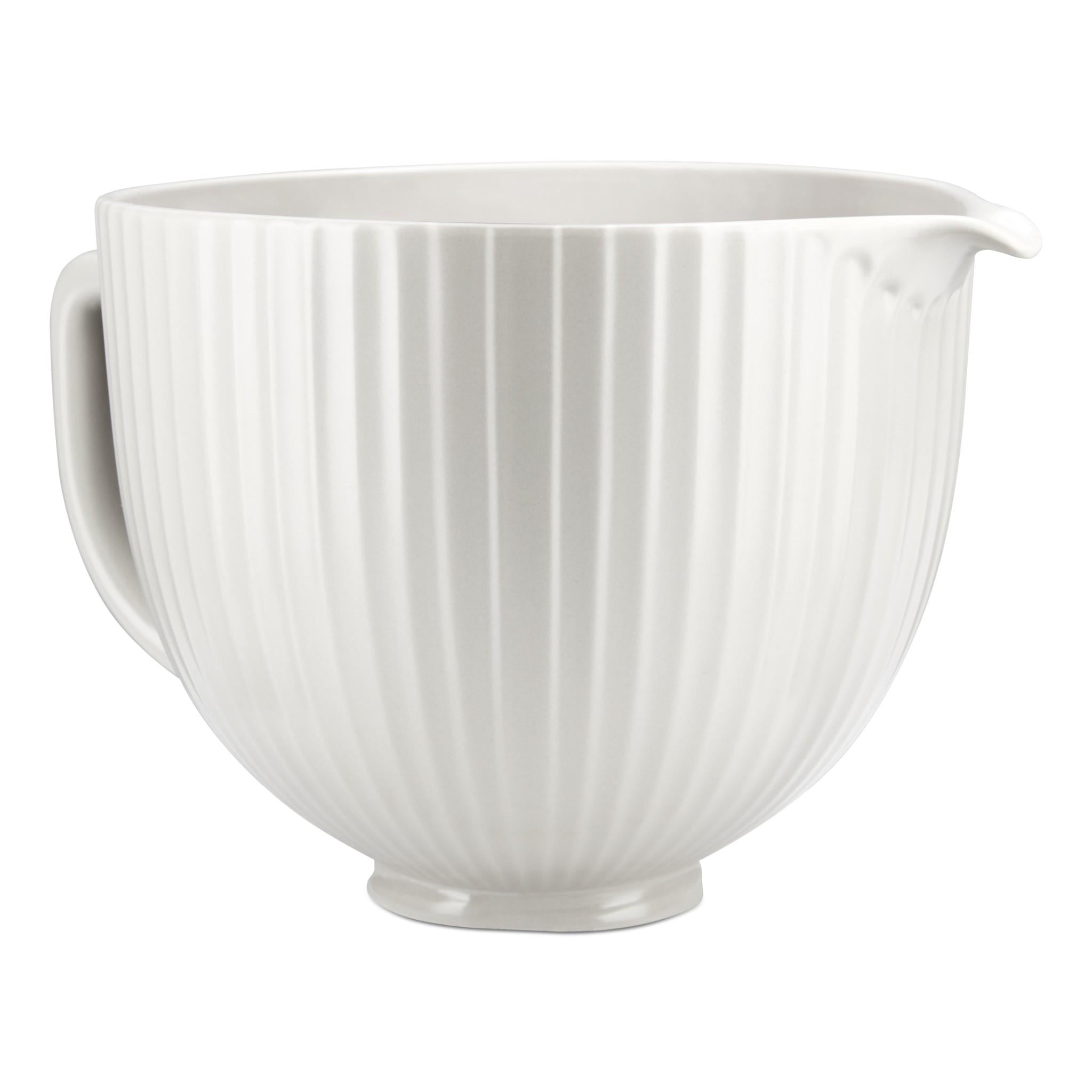 White ceramic mixing bowl with ridged sides and pouring lip