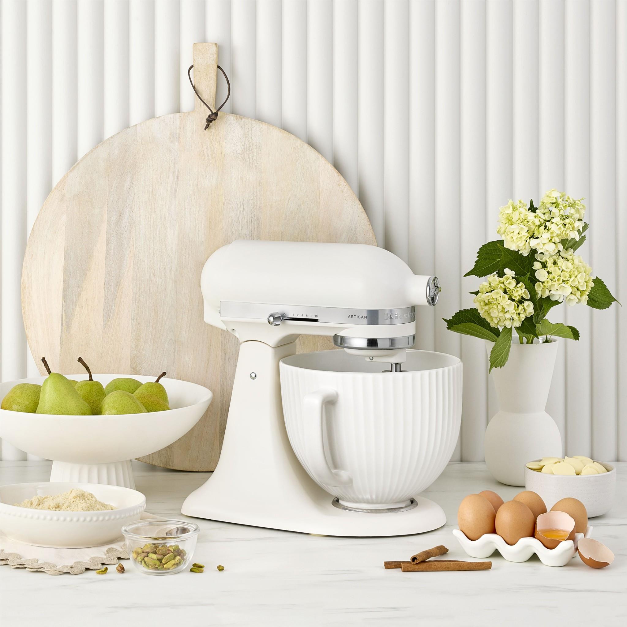White ceramic mixer bowl on stand with ridged exterior