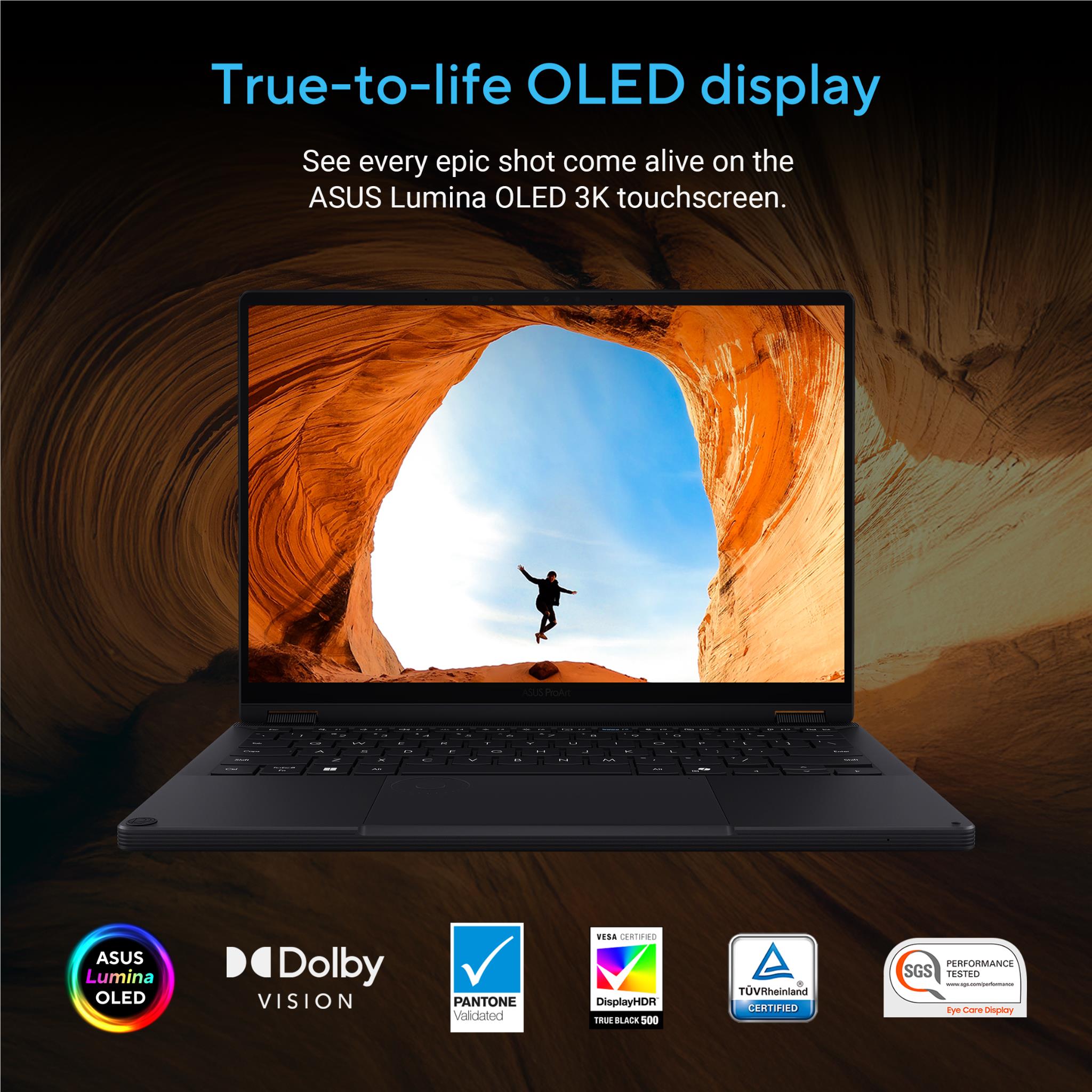 Open black laptop with OLED display showing scenic action scene