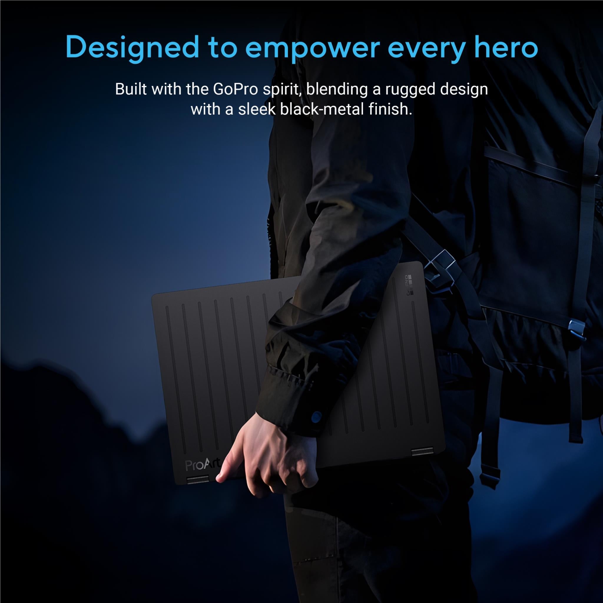 Black laptop in protective case held by a person