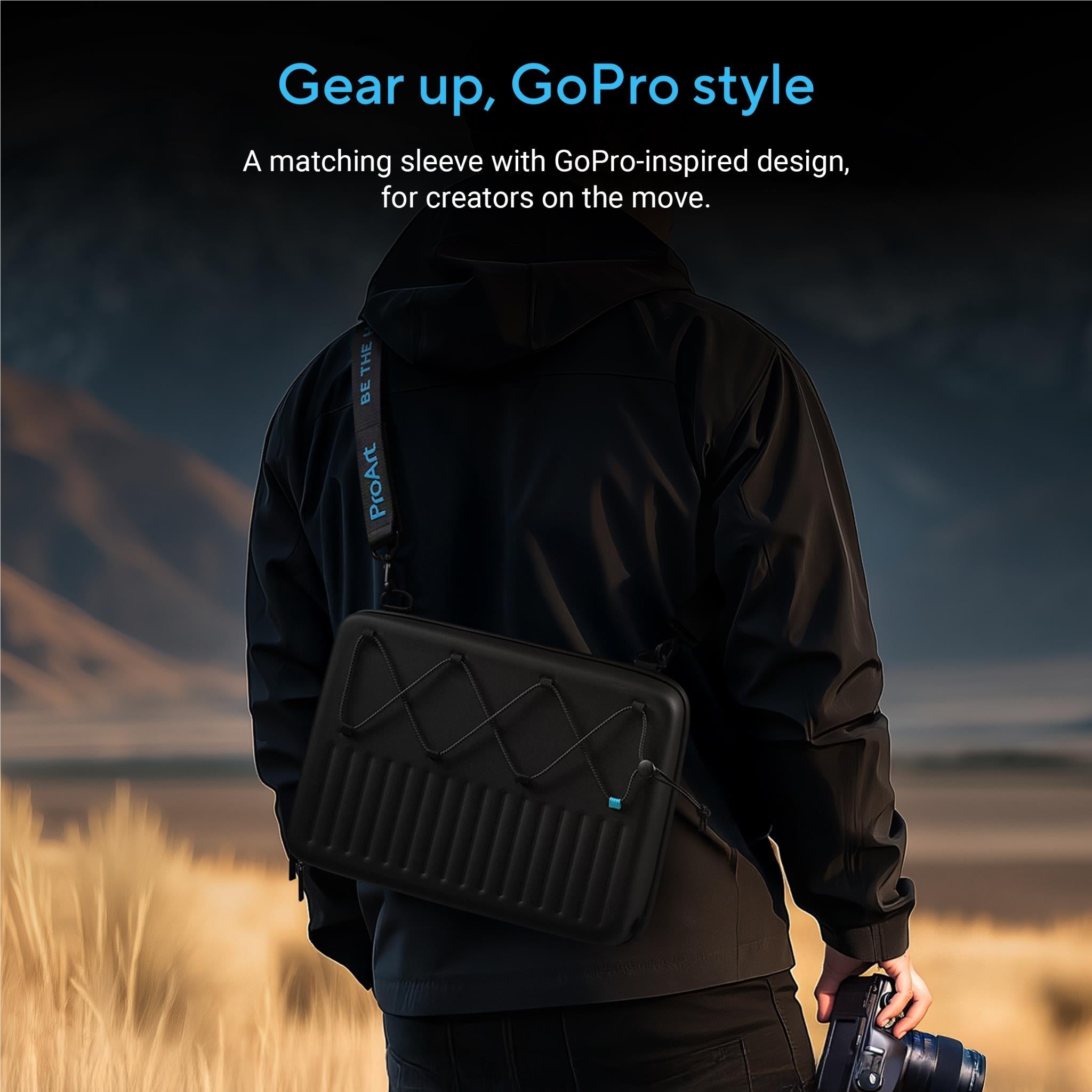 Black GoPro-style crossbody sleeve with shoulder strap, worn over jacket
