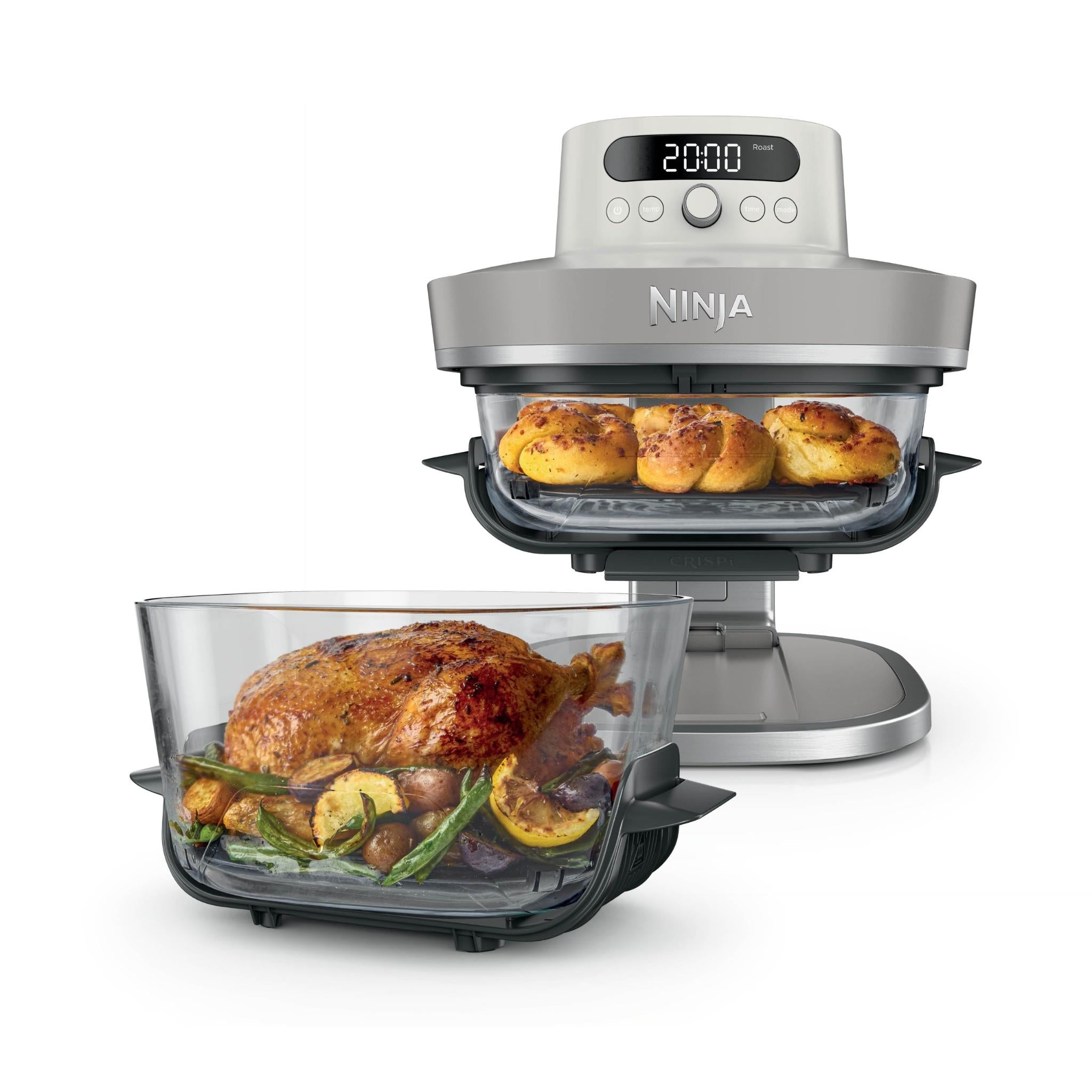 Ninja glass air fryer with roast chicken in drawer-style basket, clear glass lid