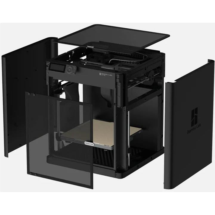 Enclosed 3D printer with panels open, showing print chamber and build bed