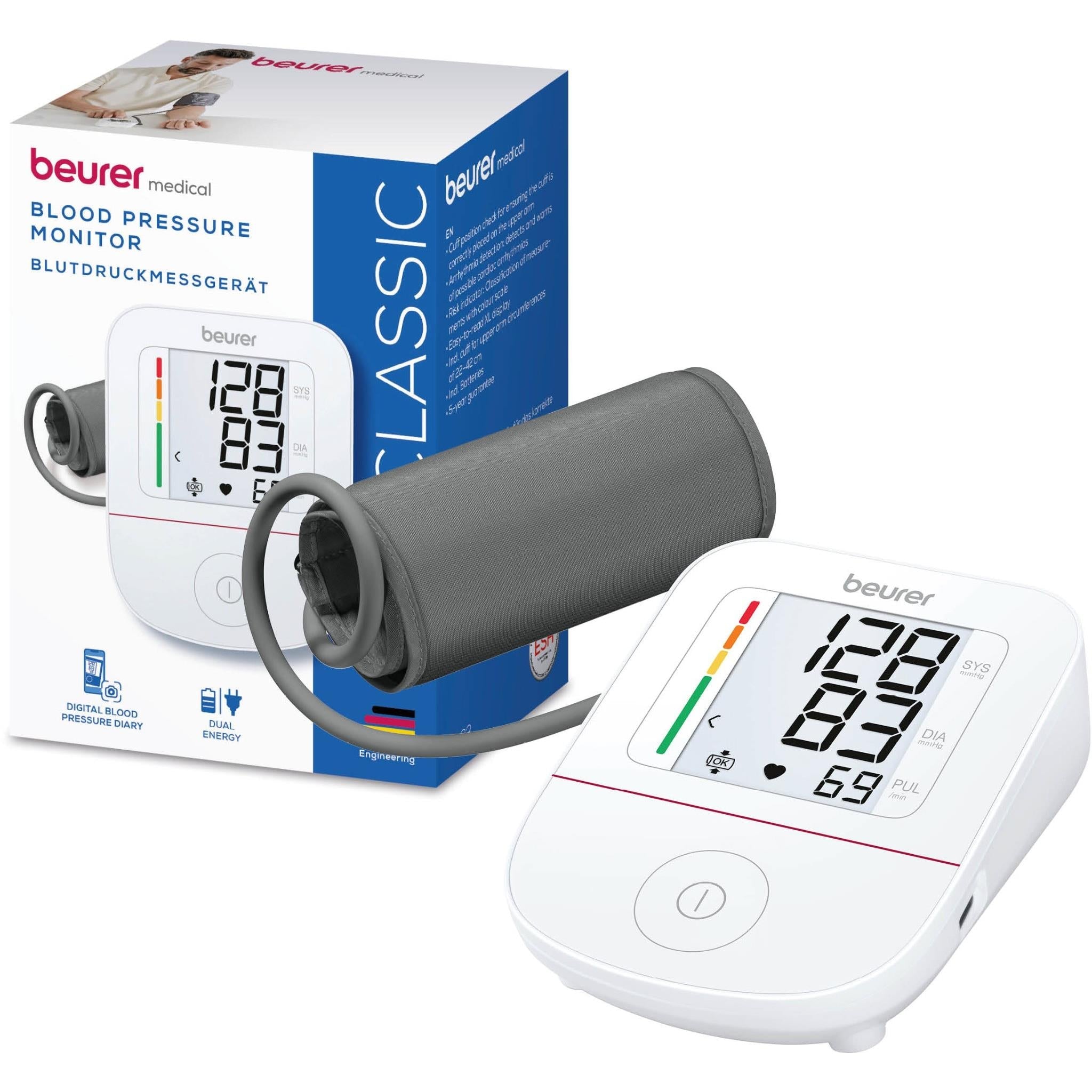 Beurer upper arm blood pressure monitor with gray cuff and white unit displaying 128/69