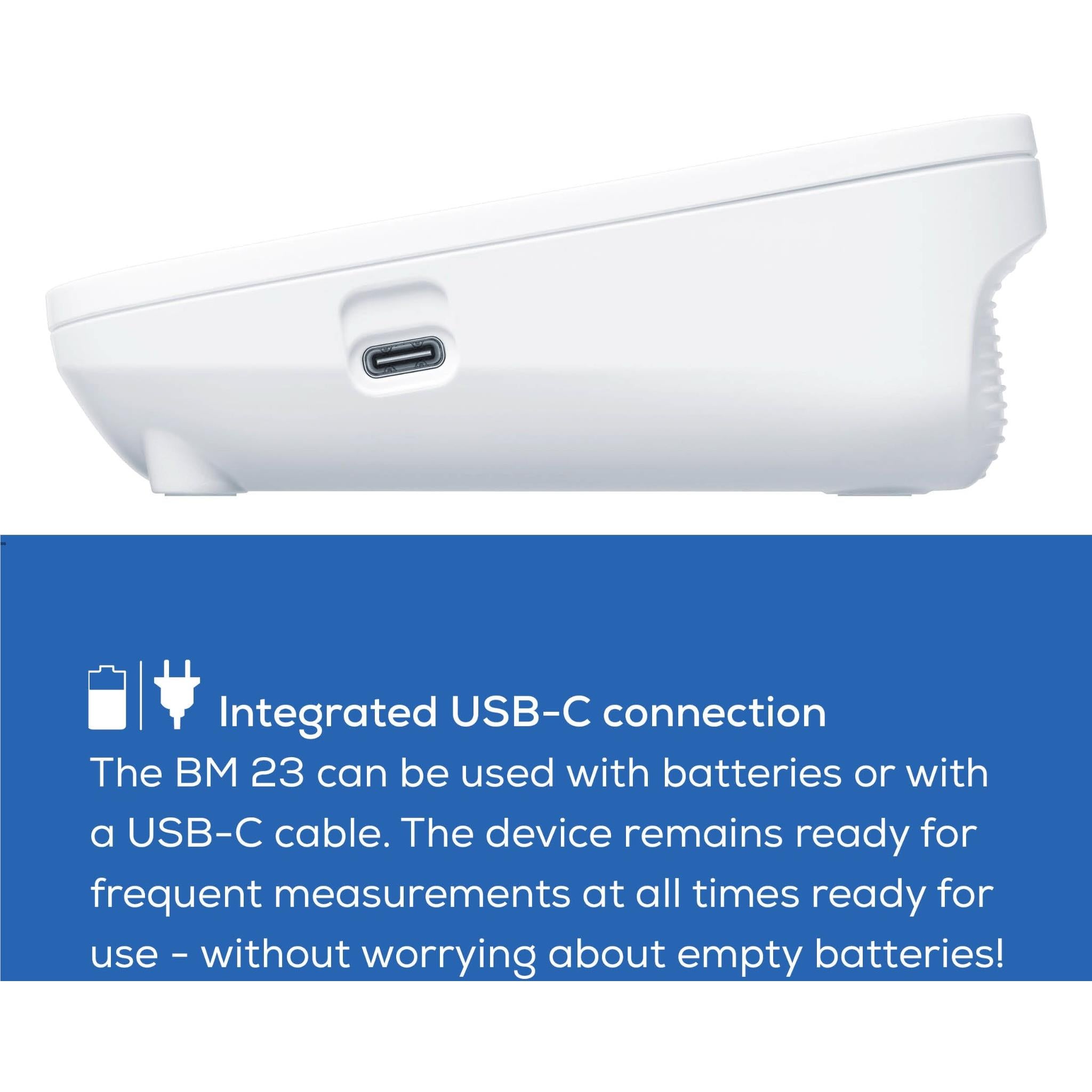 Upper arm blood pressure monitor with white body showing USB-C charging port