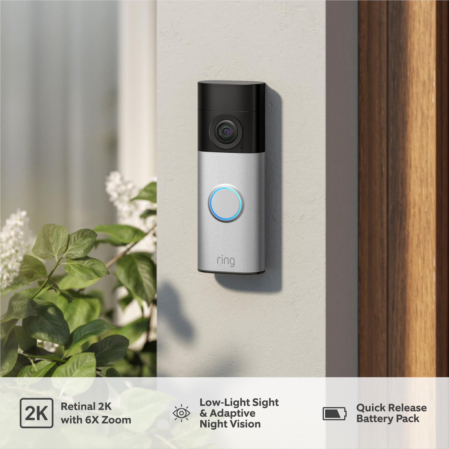 Mounted video doorbell with blue illuminated button on black and silver housing
