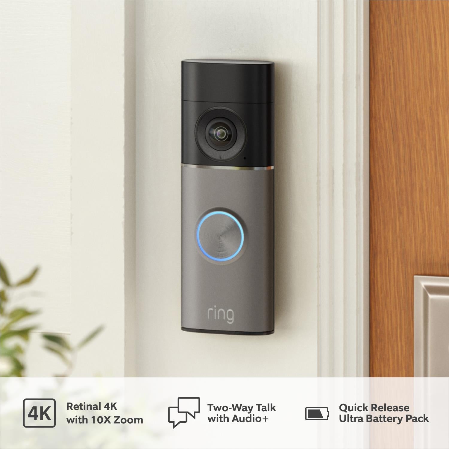 Wall-mounted Ring battery video doorbell in silver-gray with blue status ring