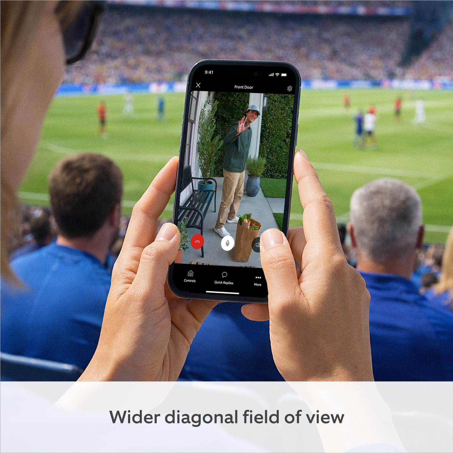 Smartphone showing Ring doorbell live video through a hands-held phone