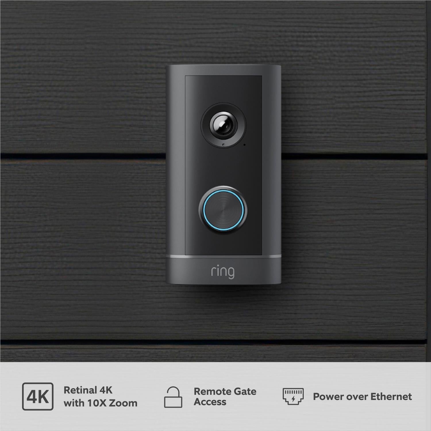 Ring wired video doorbell mounted on wall with camera and blue ring light