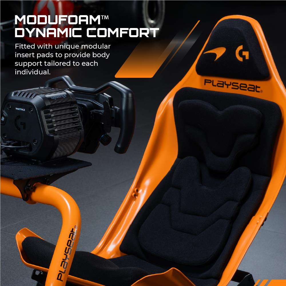 Orange racing seat with black modular cushioning and gaming-style controller mount