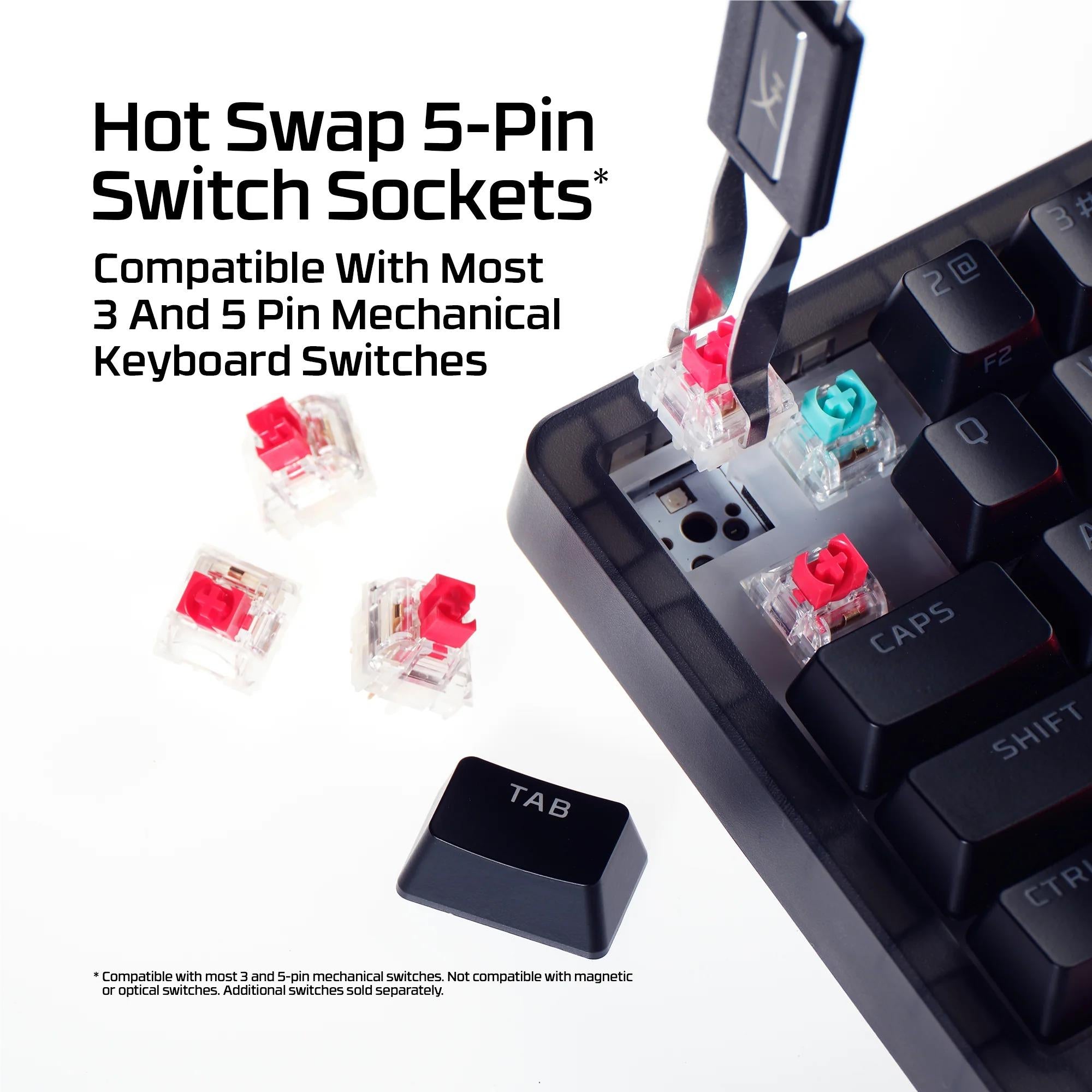 Close-up of hot-swap switch sockets and red switch housings on a keyboard