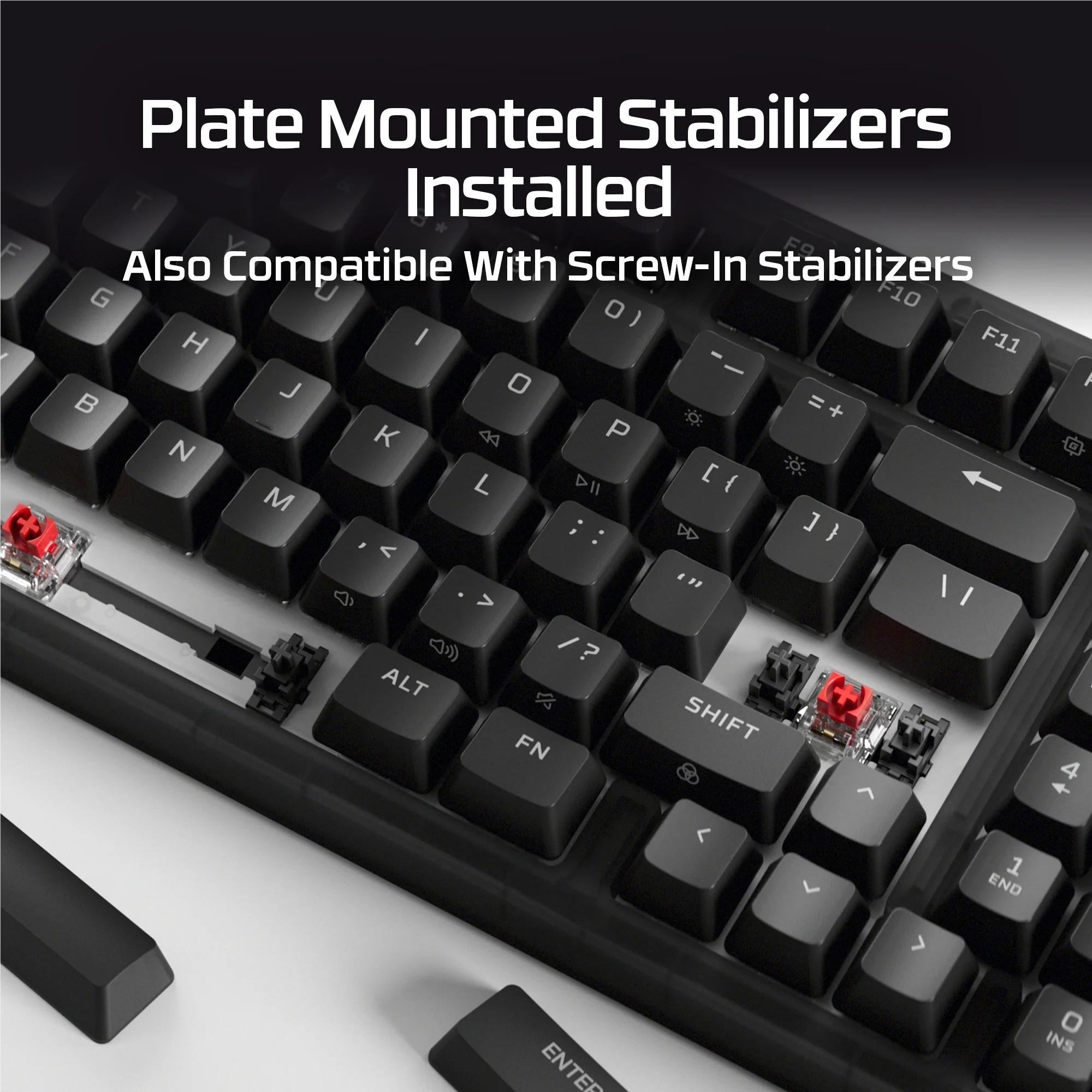 Close-up of mechanical keyboard key area with plate-mounted stabilizers and switch parts