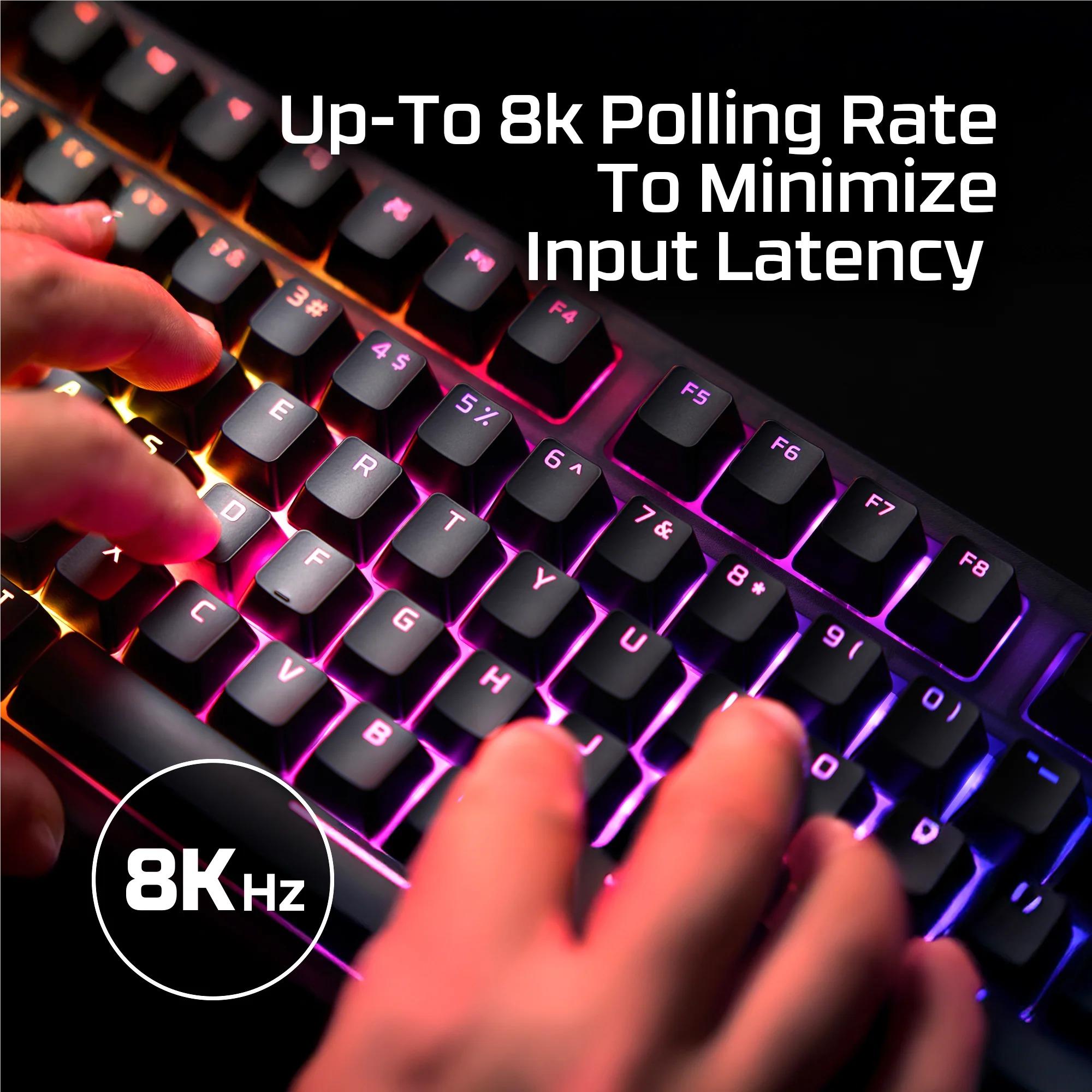 Mechanical keyboard with RGB backlighting while a hand presses keys