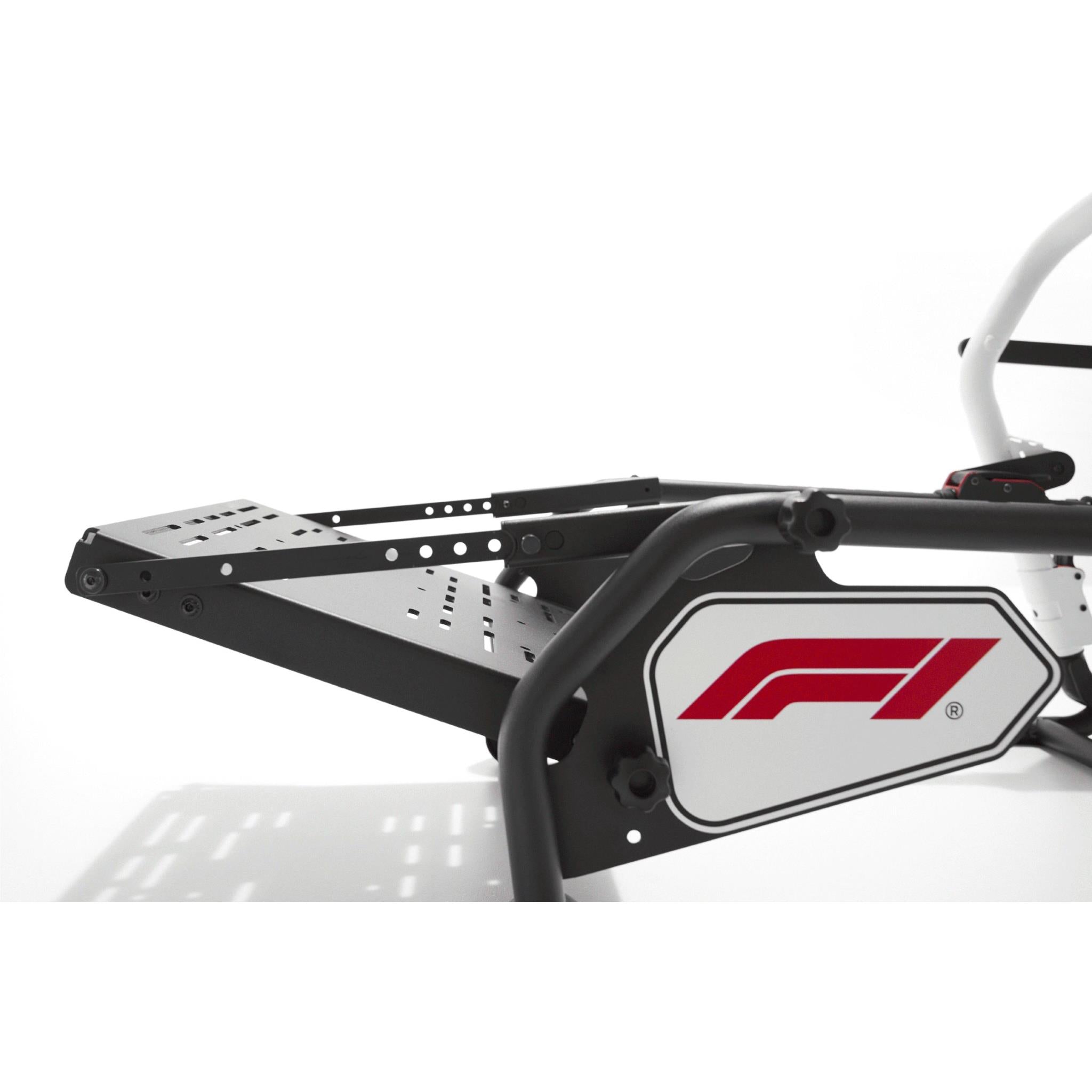 White-and-black cockpit side panel with red F1 emblem and mounting brackets